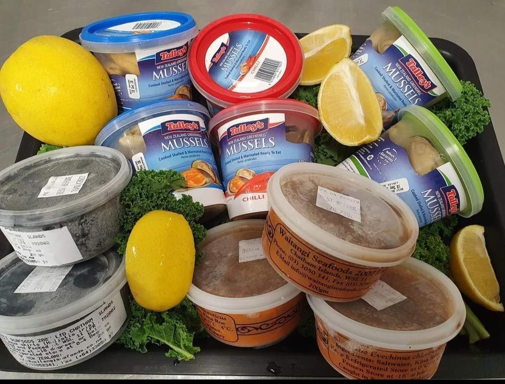 Seafood Products packed in boxes with lemon and veggies— Fish & Chip Shop in Portsmith, QLD