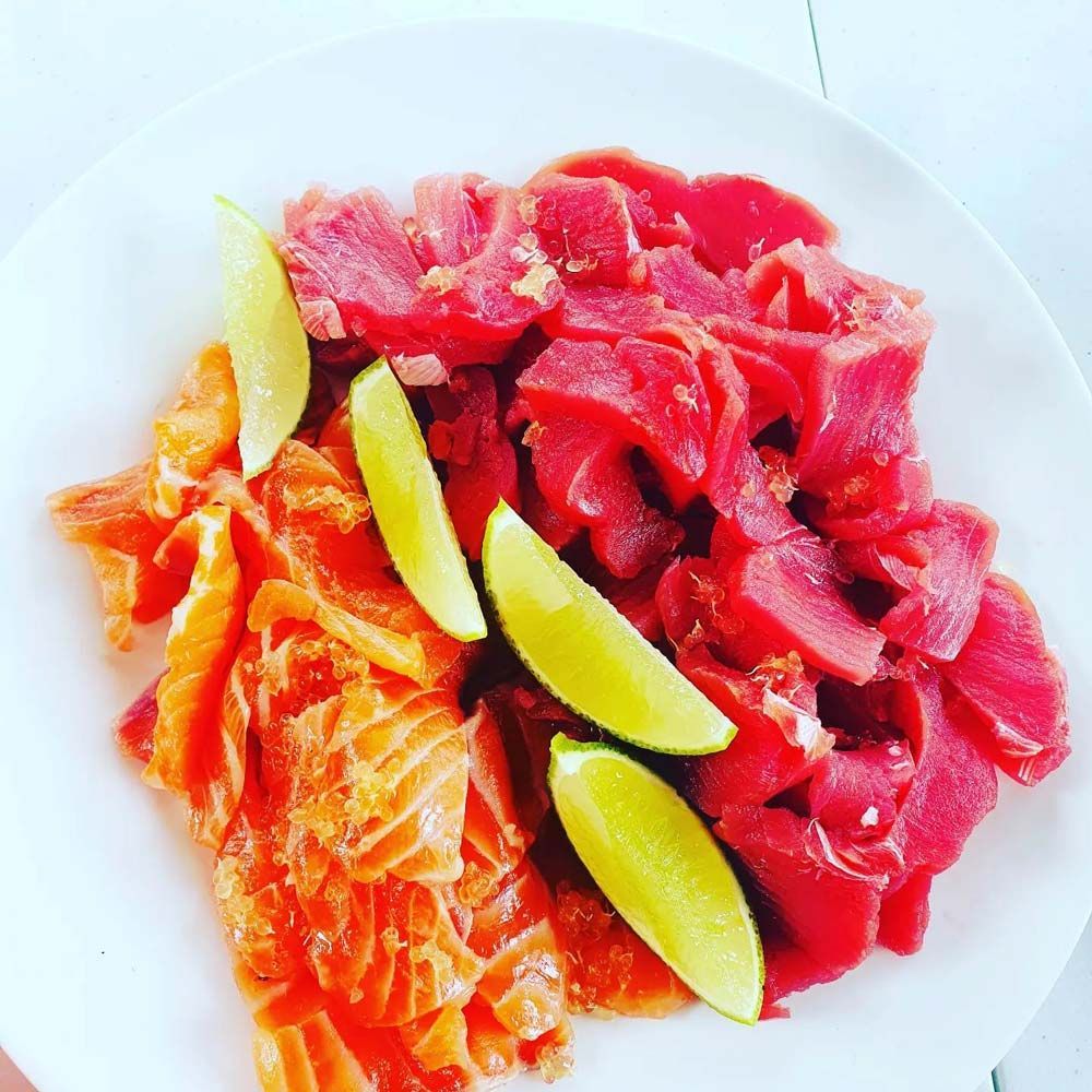 Sashimi Served With Lemons on a Plate — Local Seafood Shop in Portsmith, QLD