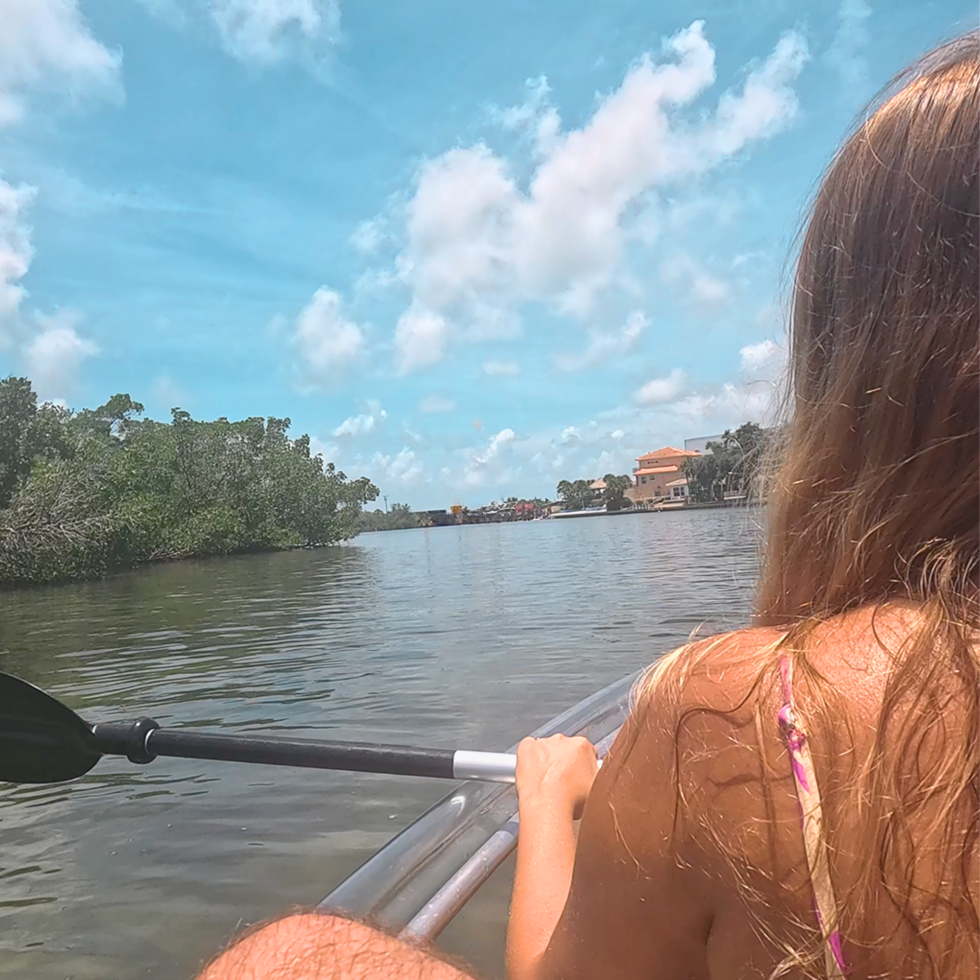 Girl kayaking near Snake Island in Nokomis Florida.