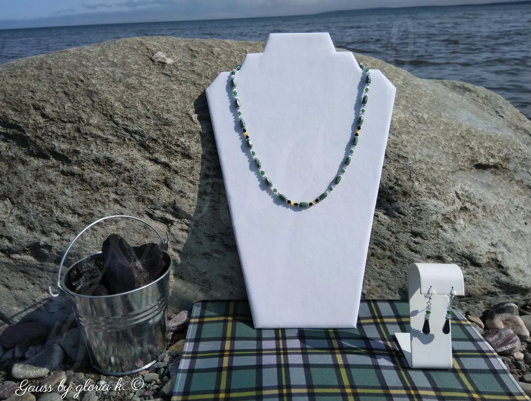 Cape Breton Tartan magnetic hematite necklace on Atlantic shoreline