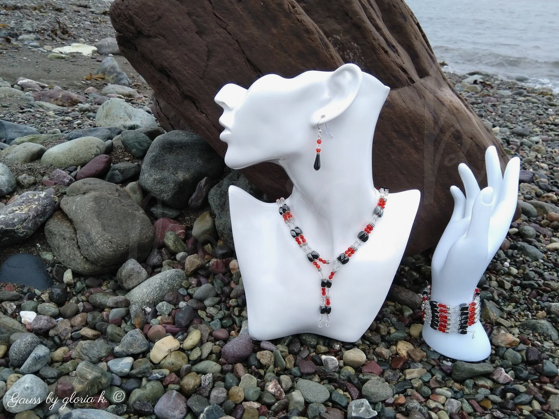 Raspberry Ice magnetic wrap necklace and bracelet on wet rocky shore