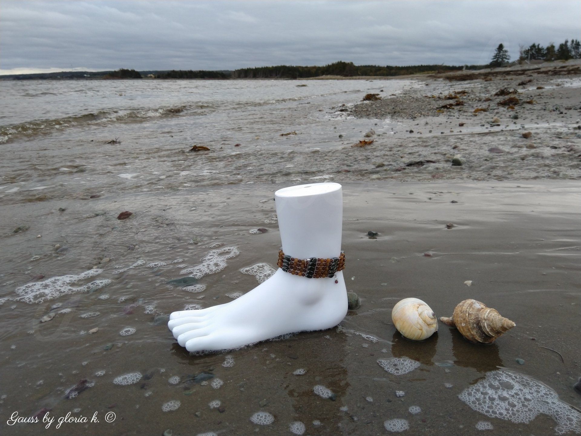 Solitude and Sand magnetic hematite wrap anklet on low tide shore with sea shells