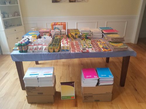 A table filled with lots of school supplies and boxes - Hickory, NC - Giving Kids Hope Foundation 