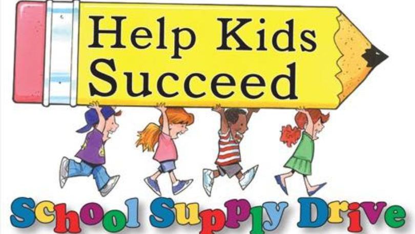 A group of children holding a large pencil that says help kids succeed - Hickory, NC - Giving Kids H