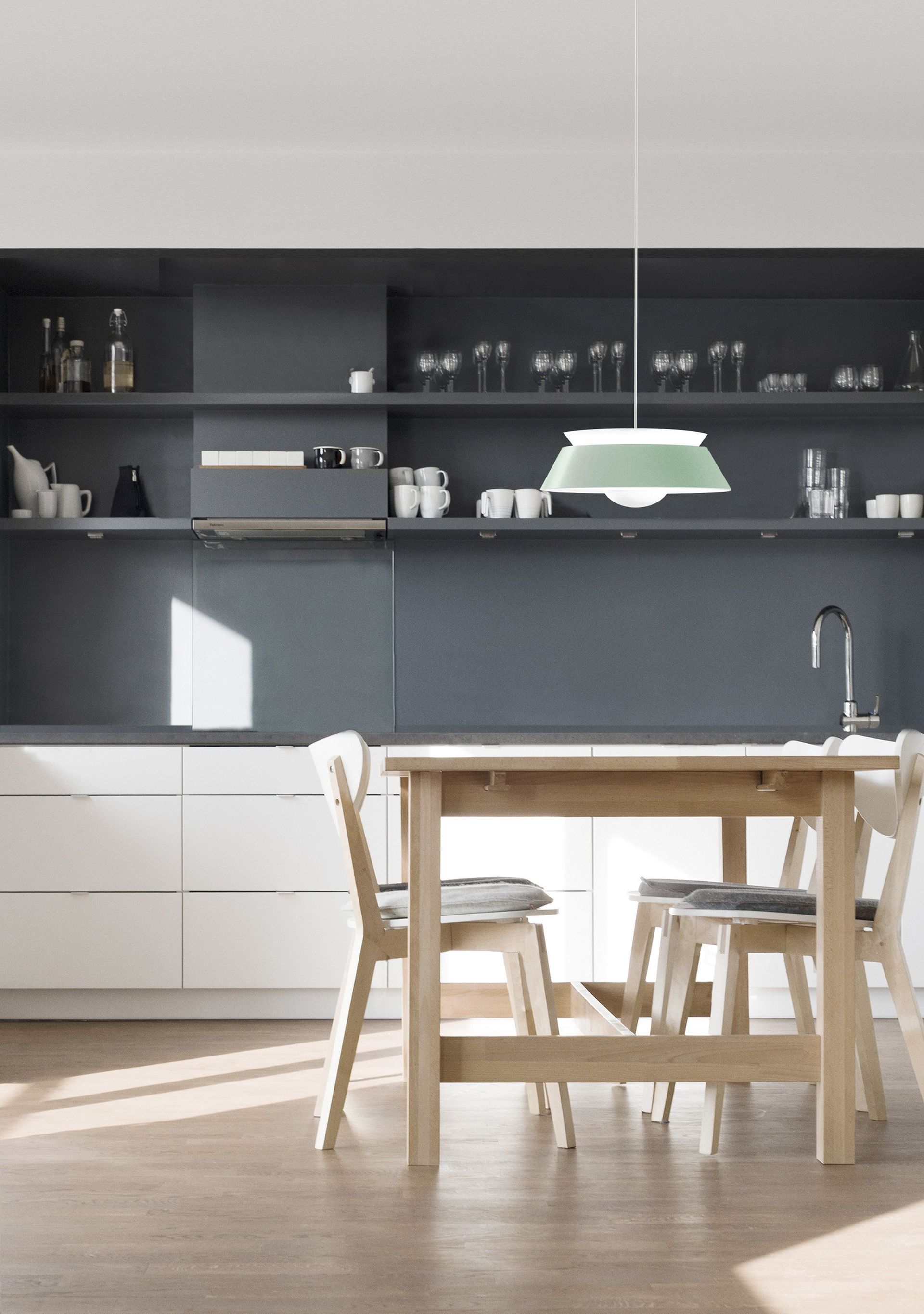 A kitchen with a table and chairs in it