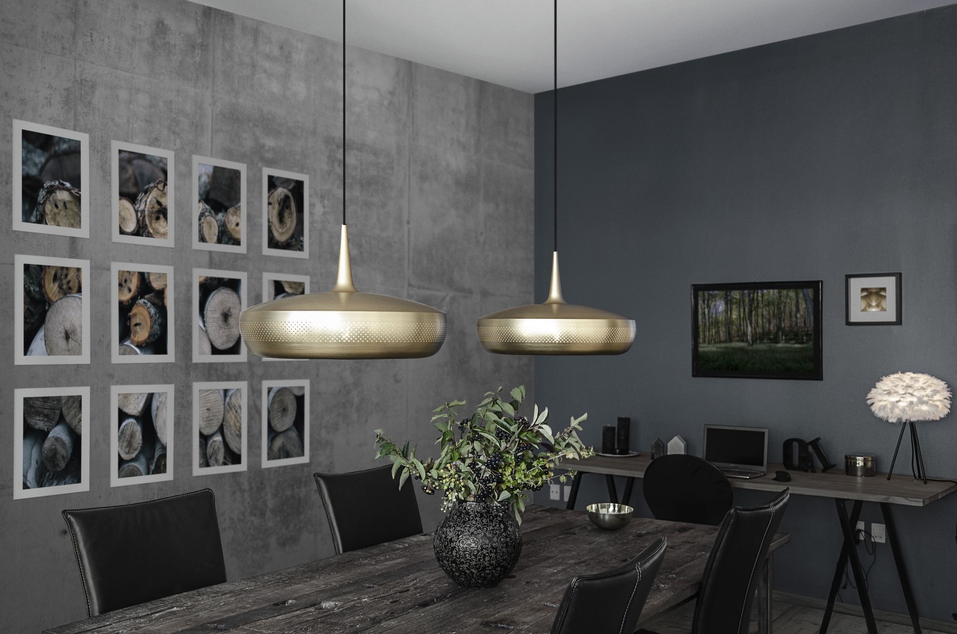 A dining room with a table and chairs and pictures on the wall