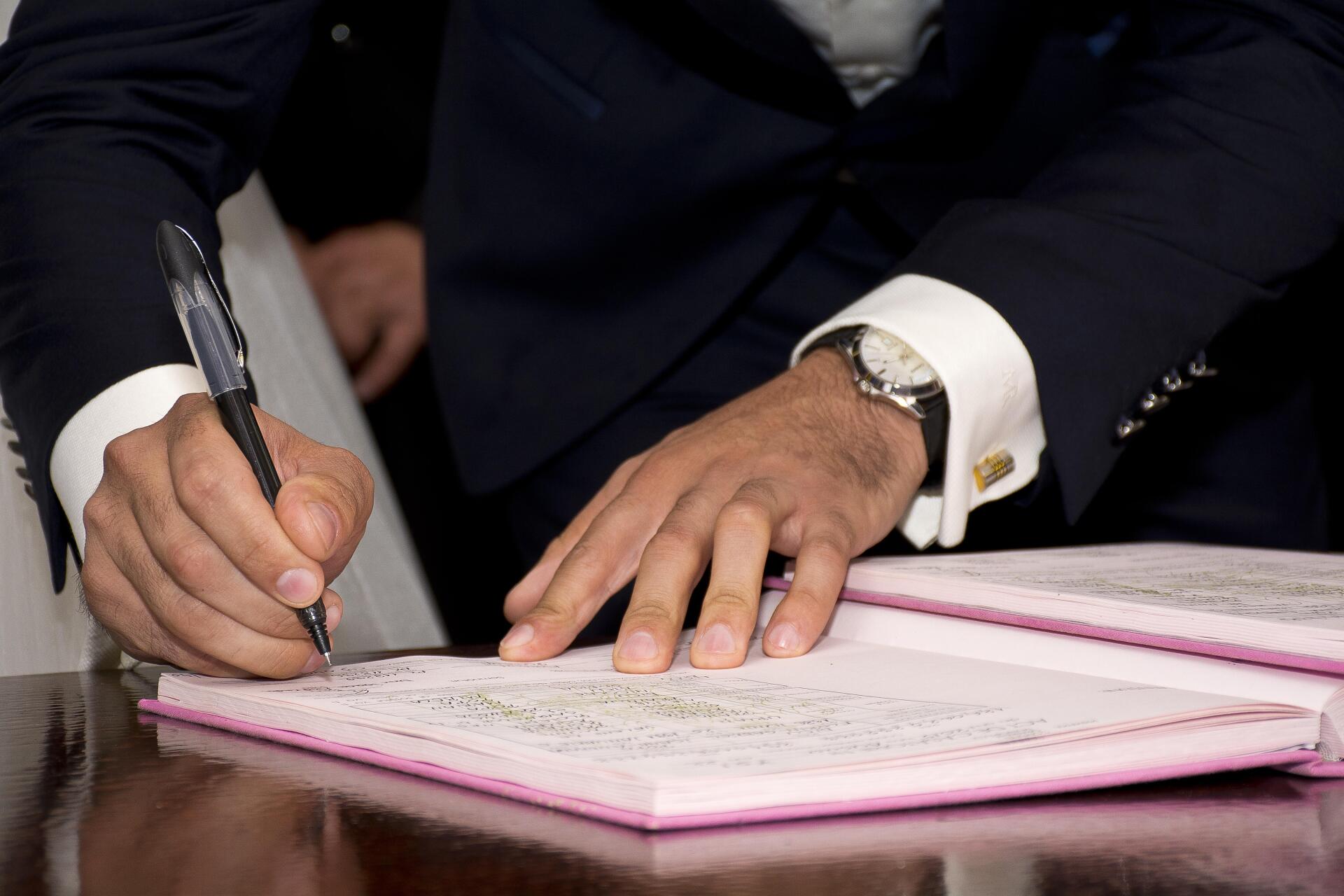 Man ratifying a document