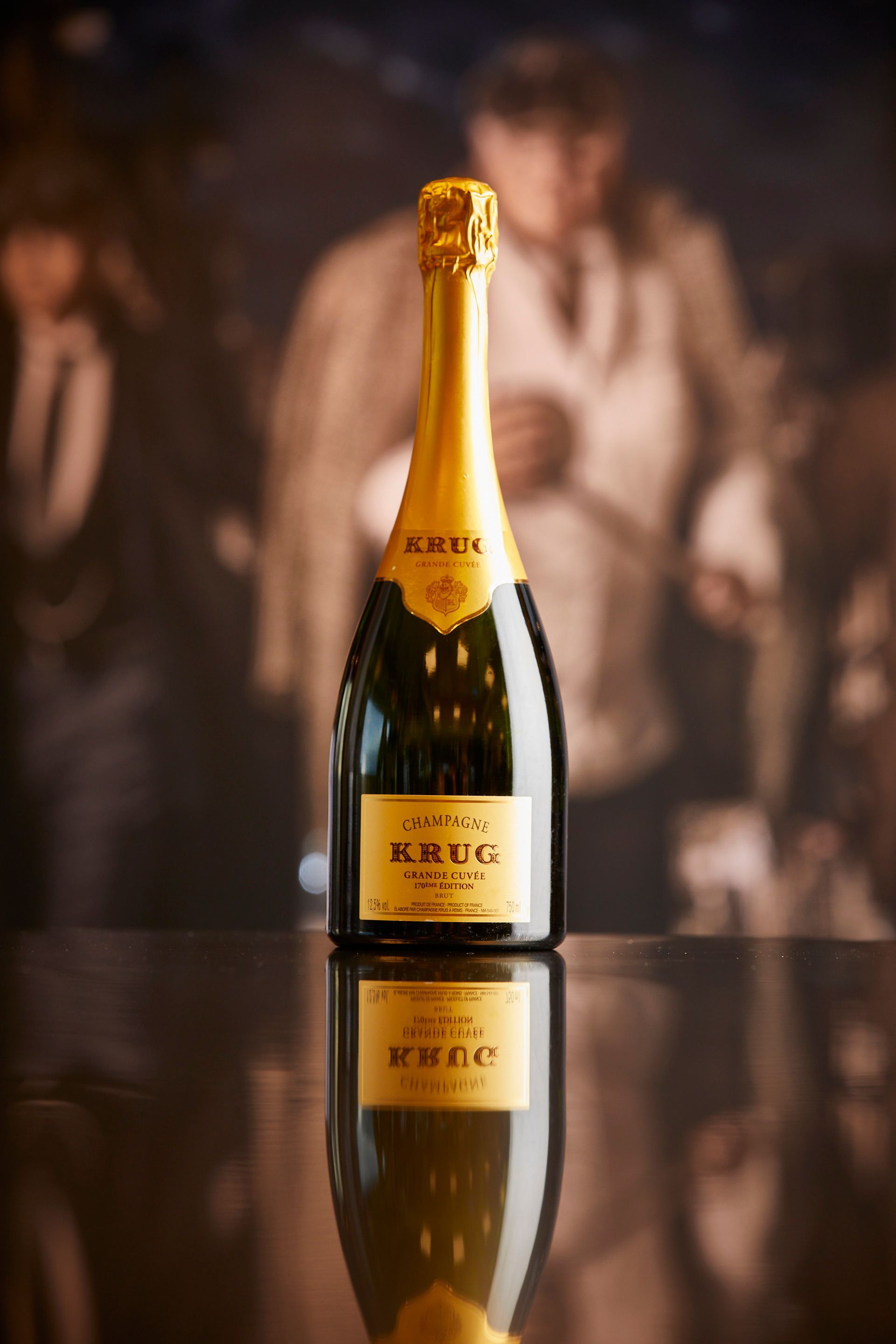 A bottle of krug champagne is sitting on a table