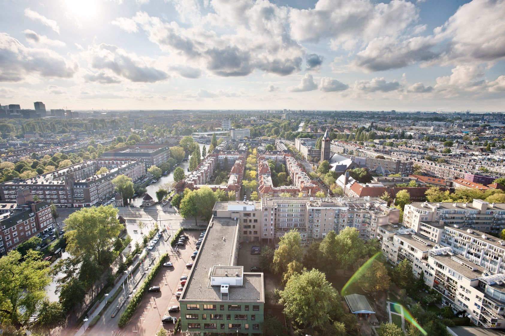 An aerial view of a city with lots of buildings and trees