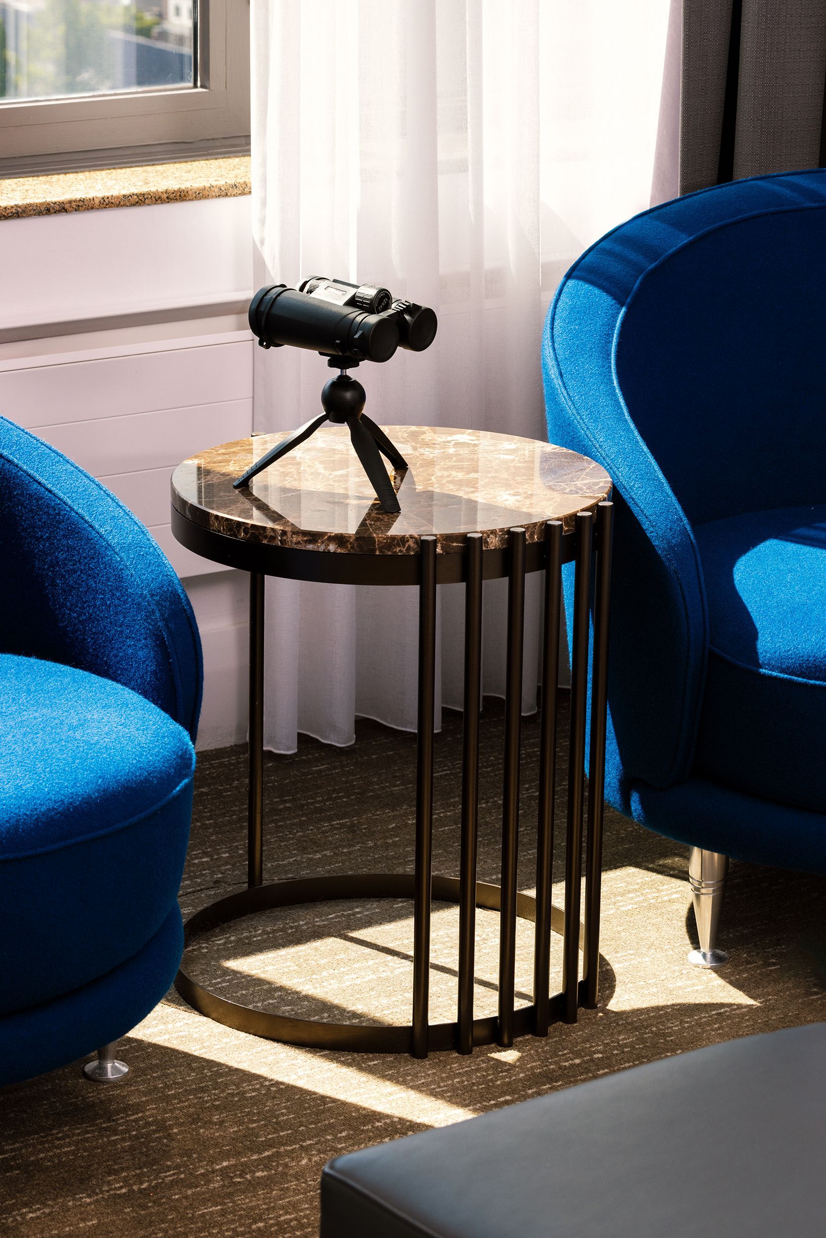 A table with binoculars on it in a living room