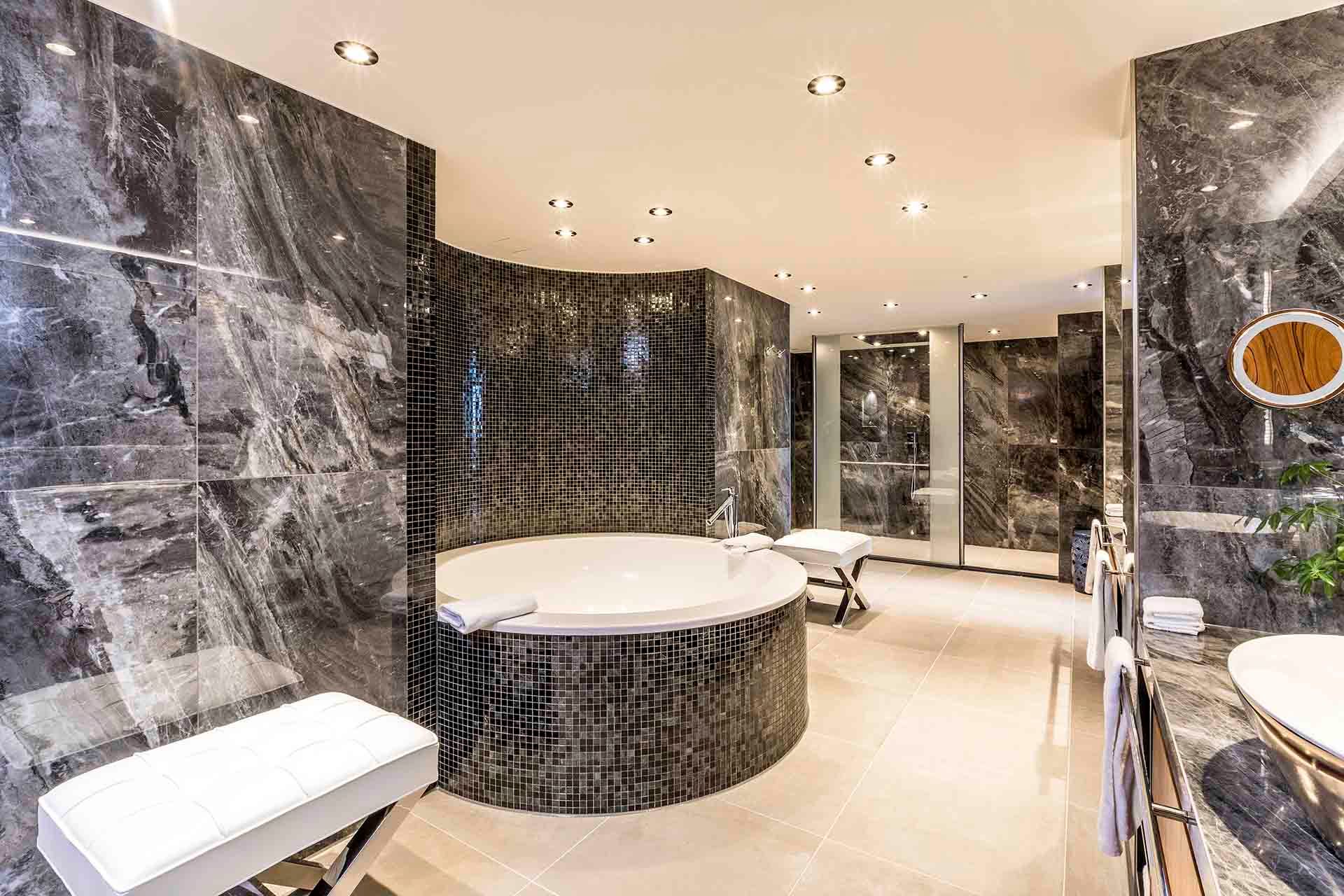 A bathroom with a jacuzzi tub and a sink.