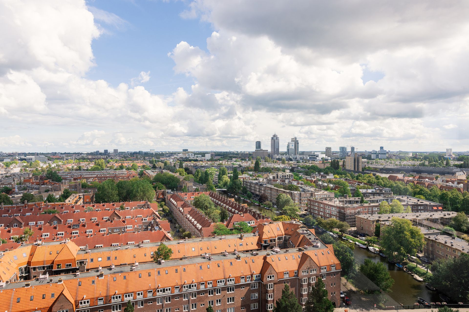 An aerial view of a city with a lot of buildings and trees