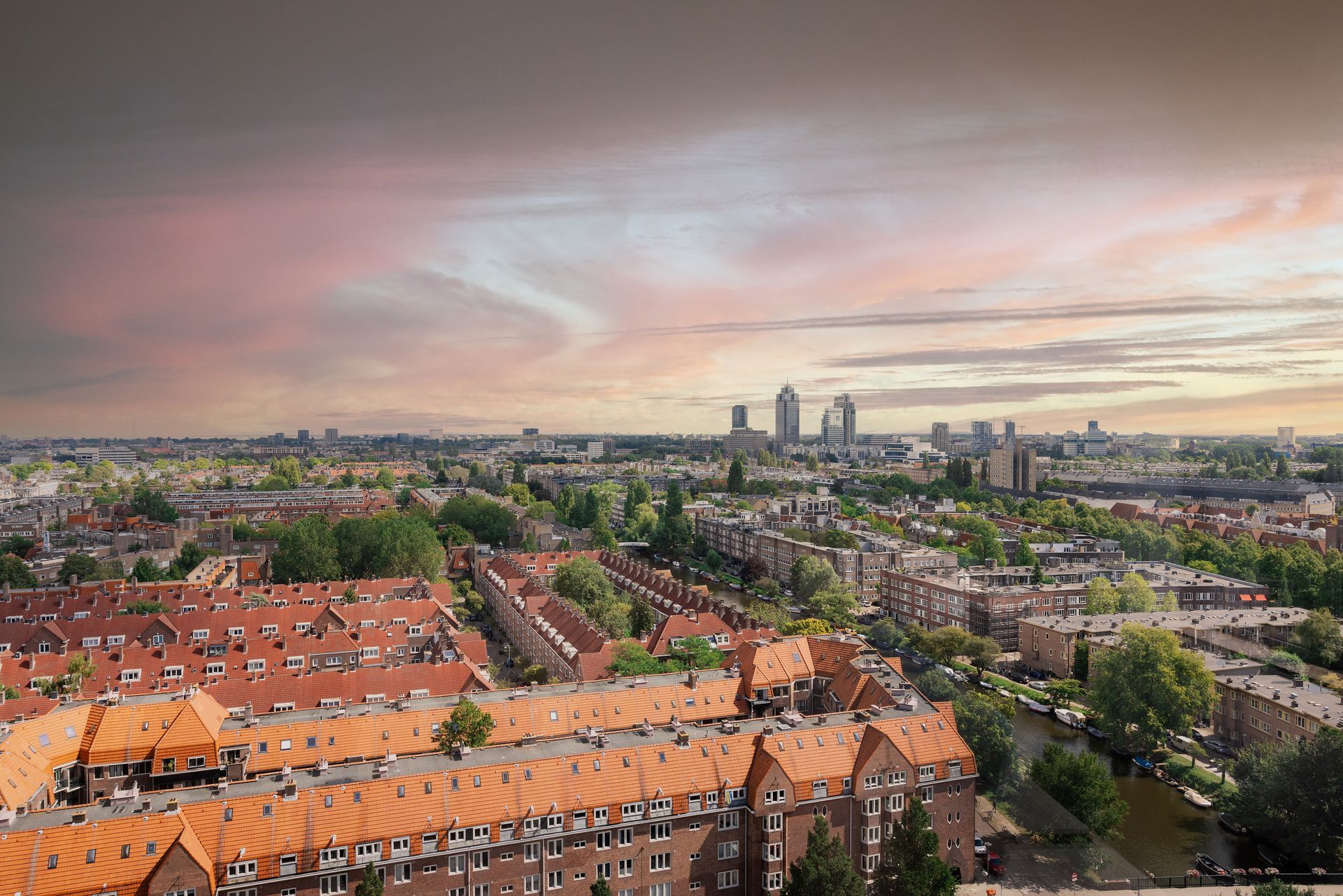 An aerial view of a city with a lot of buildings and trees.