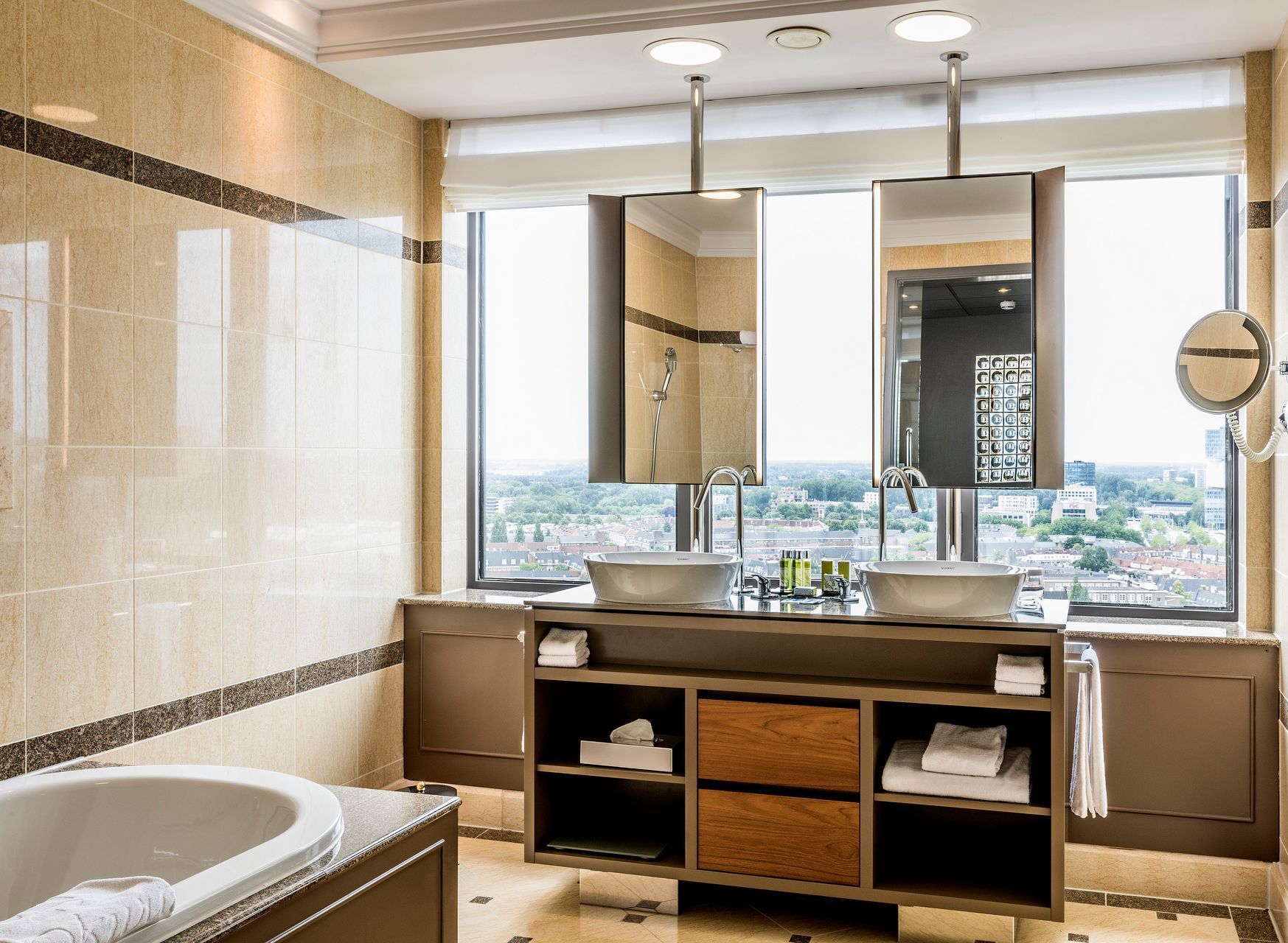 A bathroom with two sinks and a bathtub