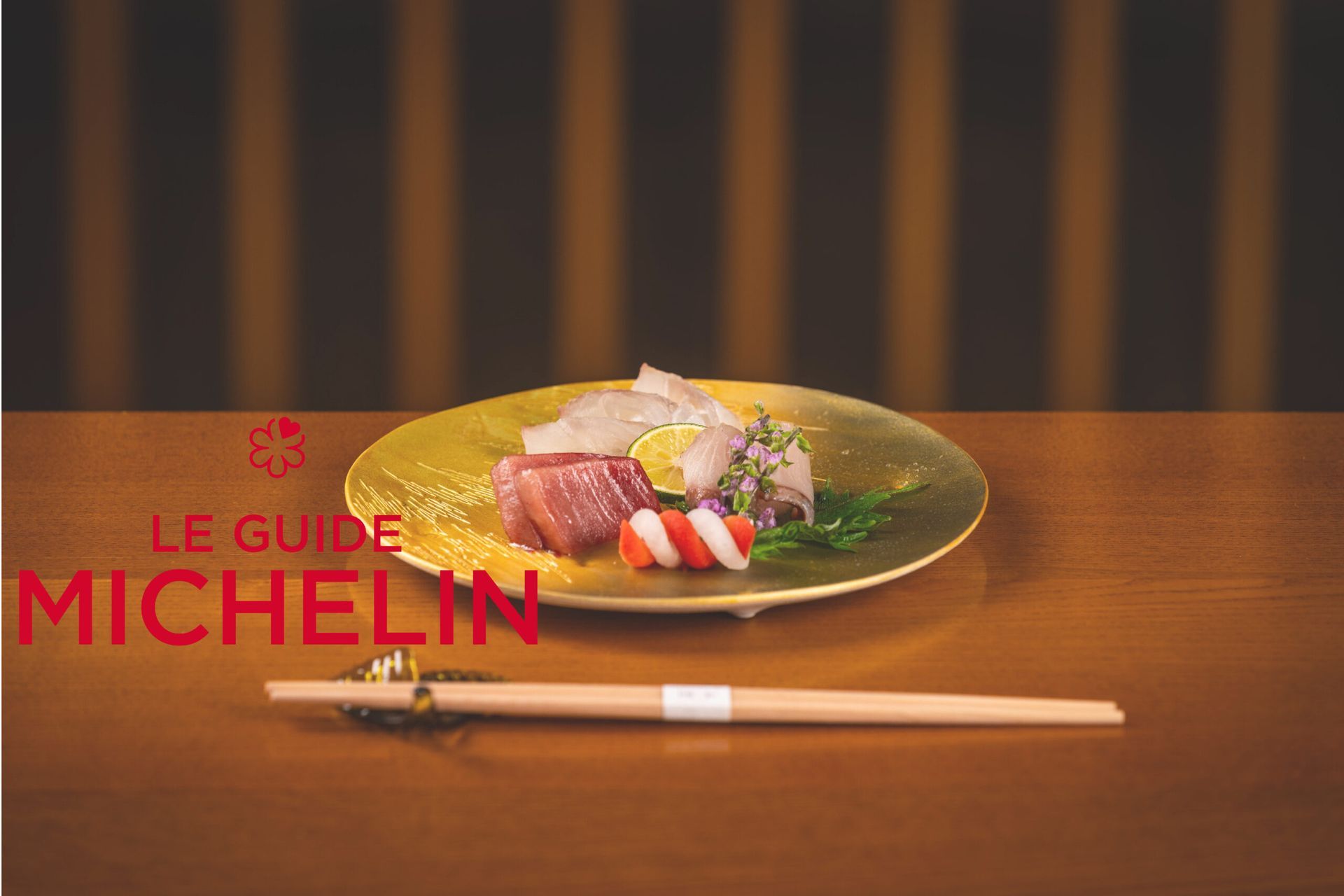 A plate of food with chopsticks on a wooden table.