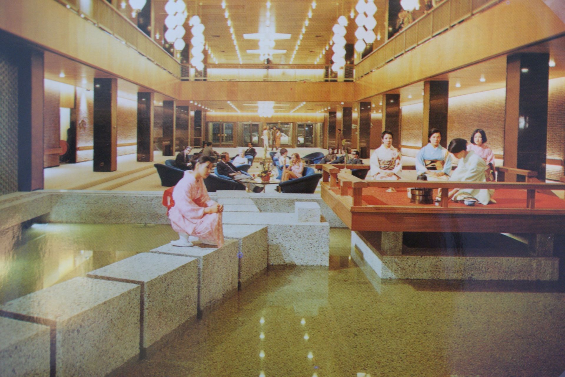 A group of people are sitting in a large room