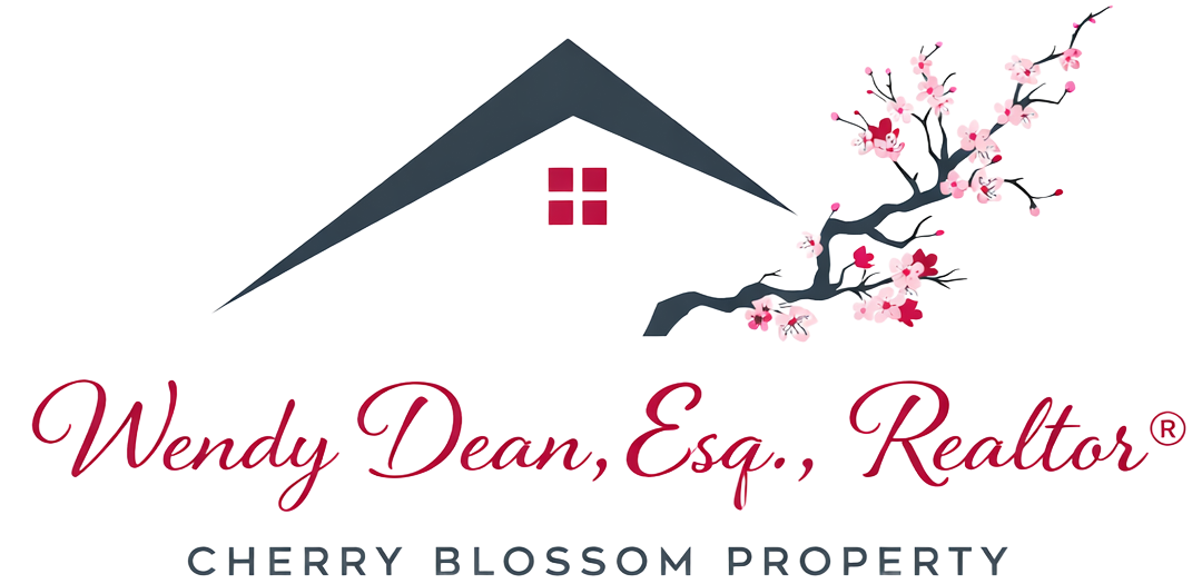 Cherry blossoms in pink and red in front of a gray cityscape, with