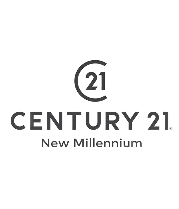 Cherry blossoms in pink and red in front of a gray cityscape, with