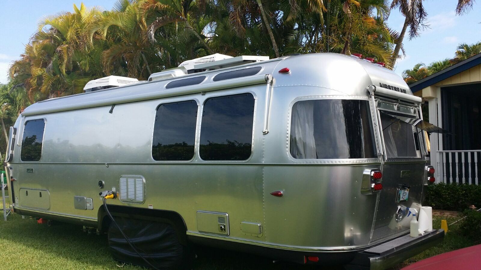 Travel Trailer Parked Outside The House — Miami, FL — Solar Tint, Inc.