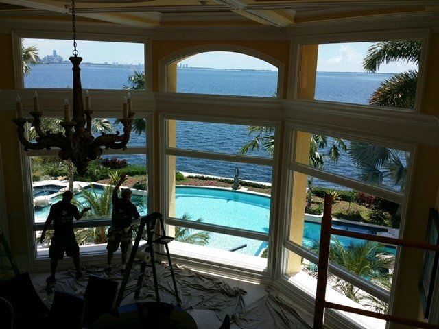 Workers Working On The Windows — Miami, FL — Solar Tint, Inc.