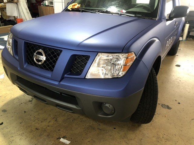 Blue Nissan Motorcar In The Garage — Miami, FL — Solar Tint, Inc.