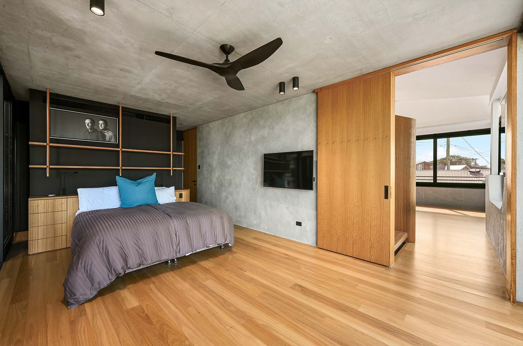 Modern Bedroom With Wood Floors with Gray Walls — PK Kitchen Design in West Ipswich, QLD