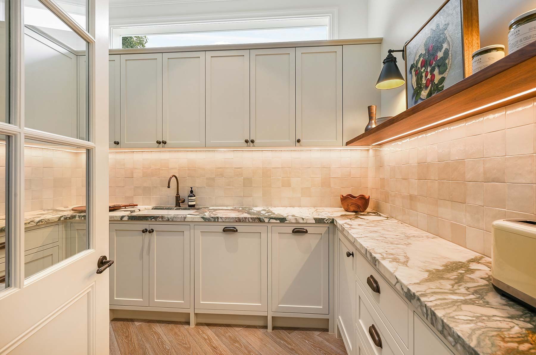 White Kitchen With Marble Countertops, Cabinets, and a Tiled Backsplash — PK Kitchen Design in West Ipswich, QLD