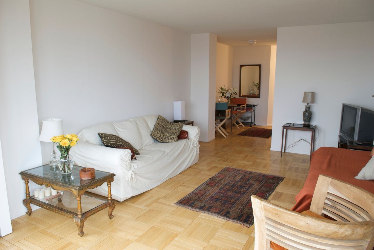 A living room with a couch and a table