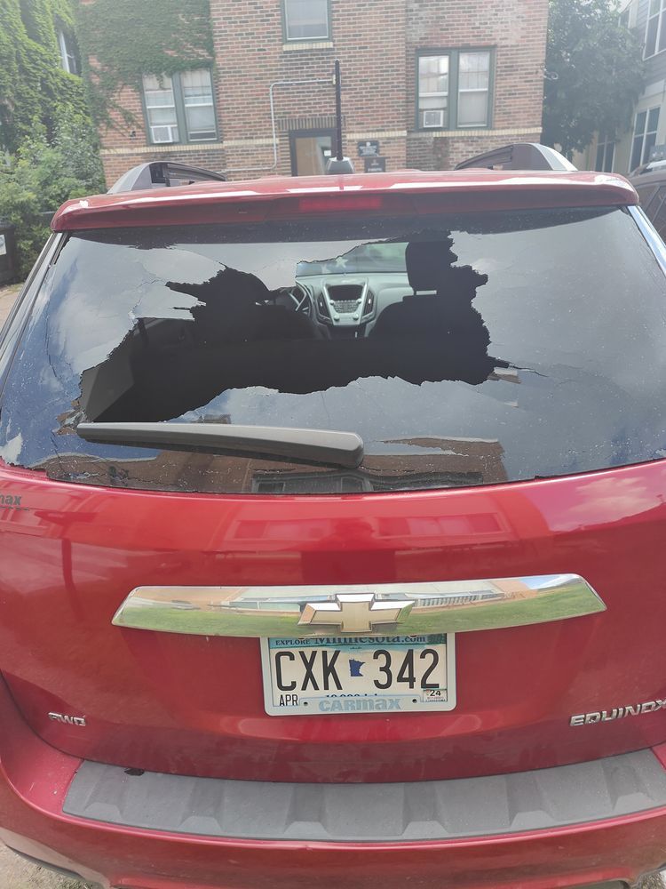 A red car with a license plate that says cxk 342