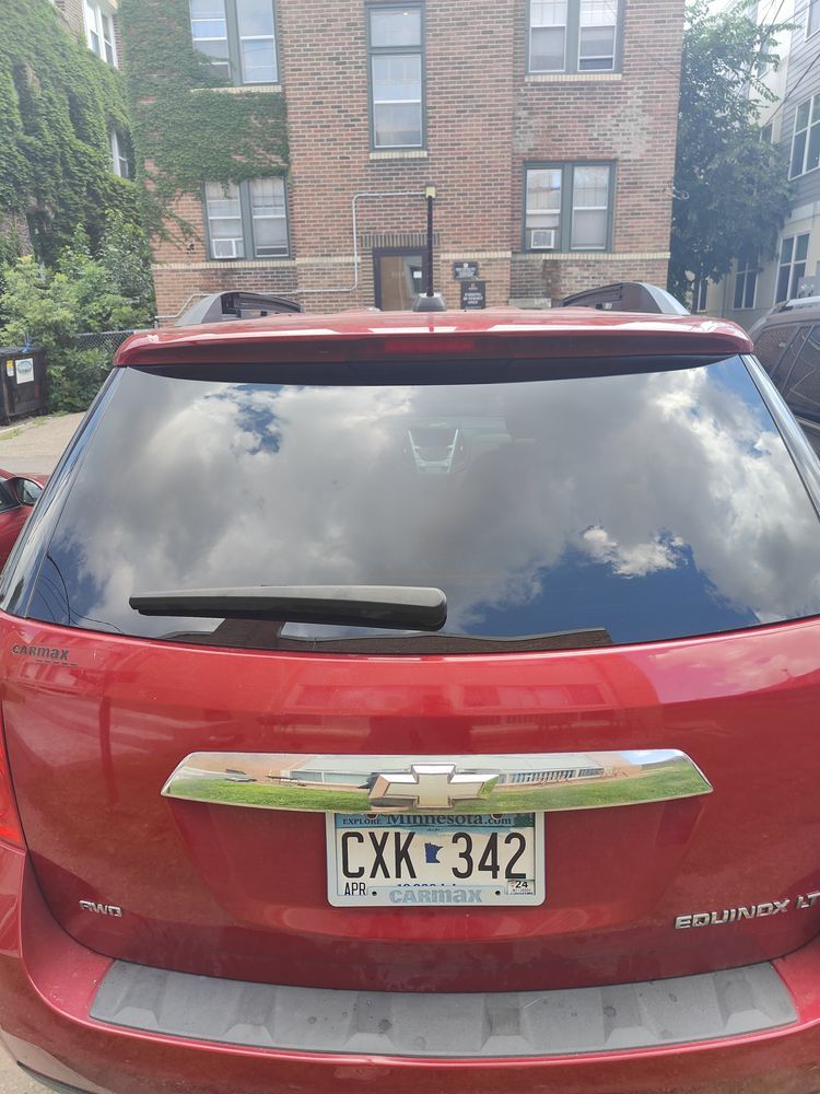 A red car with a license plate that says cxk342