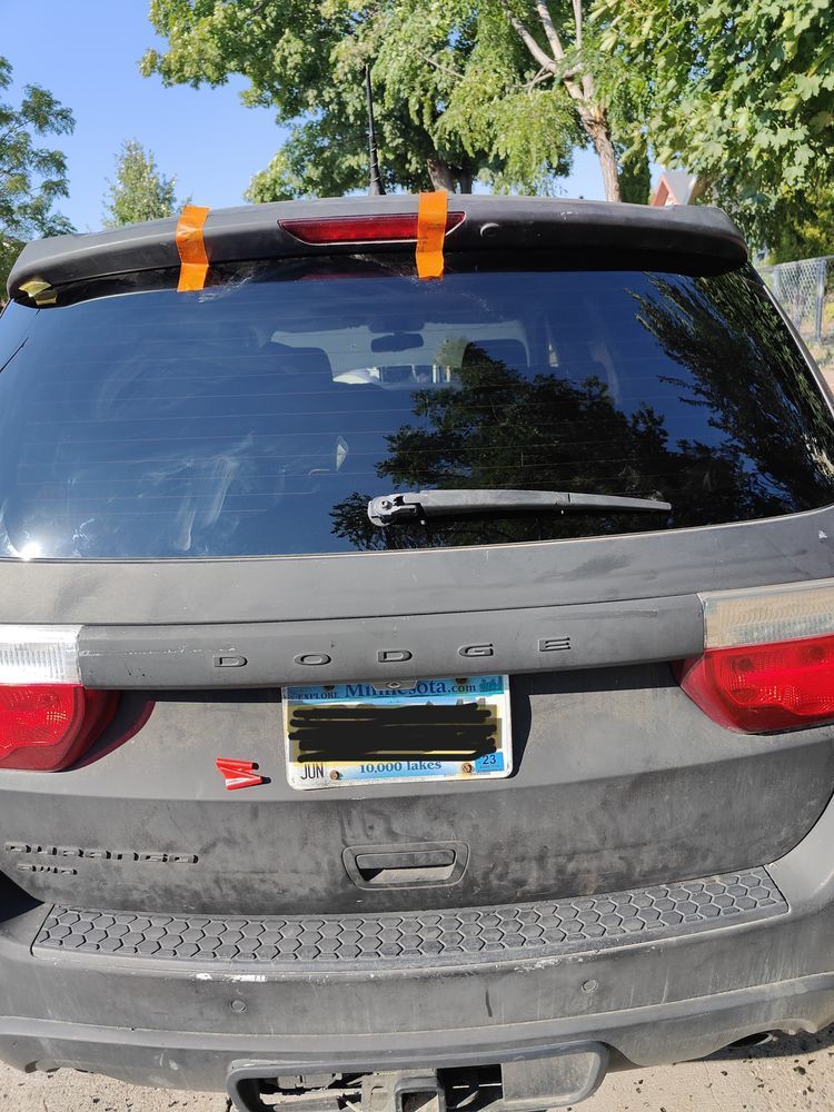A dodge caravan with a california license plate