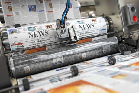 A Newspaper Is Being Printed on A Printing Machine - Jasper, IN - Impressions Printing Inc