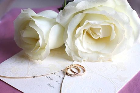 Two White Roses Are Sitting on Top of A Wedding Invitation - Jasper, IN - Impressions Printing Inc