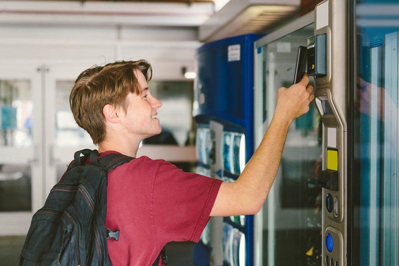 Vending Machines — Man Using Vending Machine in Charlotte, NC