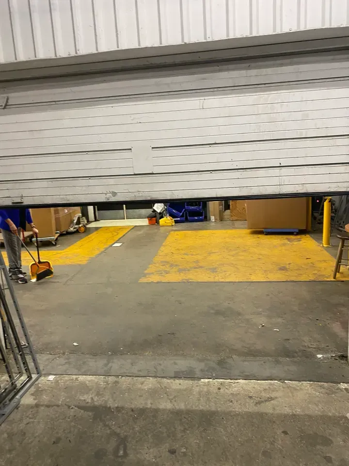 Loading dock: partial view through an open overhead door. 