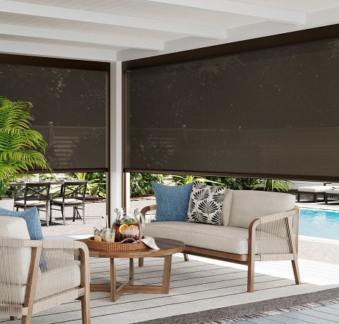 A living room with a couch , chairs , and a table.