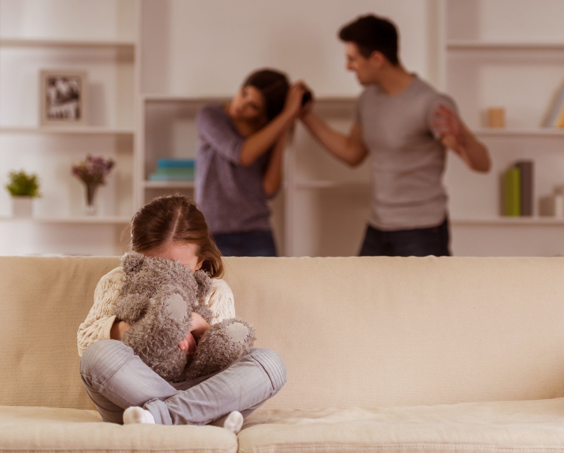 A child suffering from quarrels between parents in the family at home