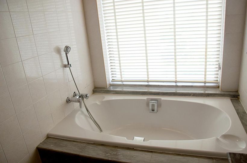 bathtub near the window