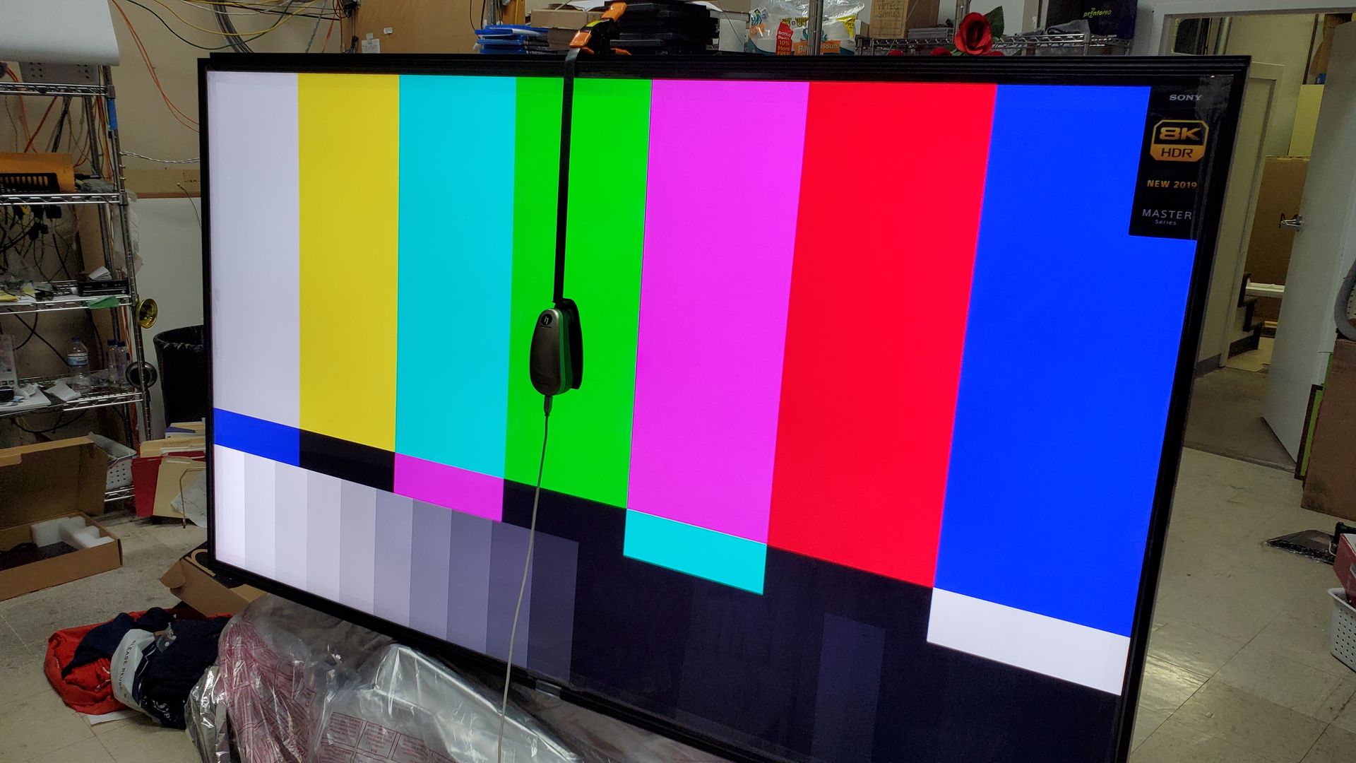 A large flat screen tv is sitting on a table in a room.