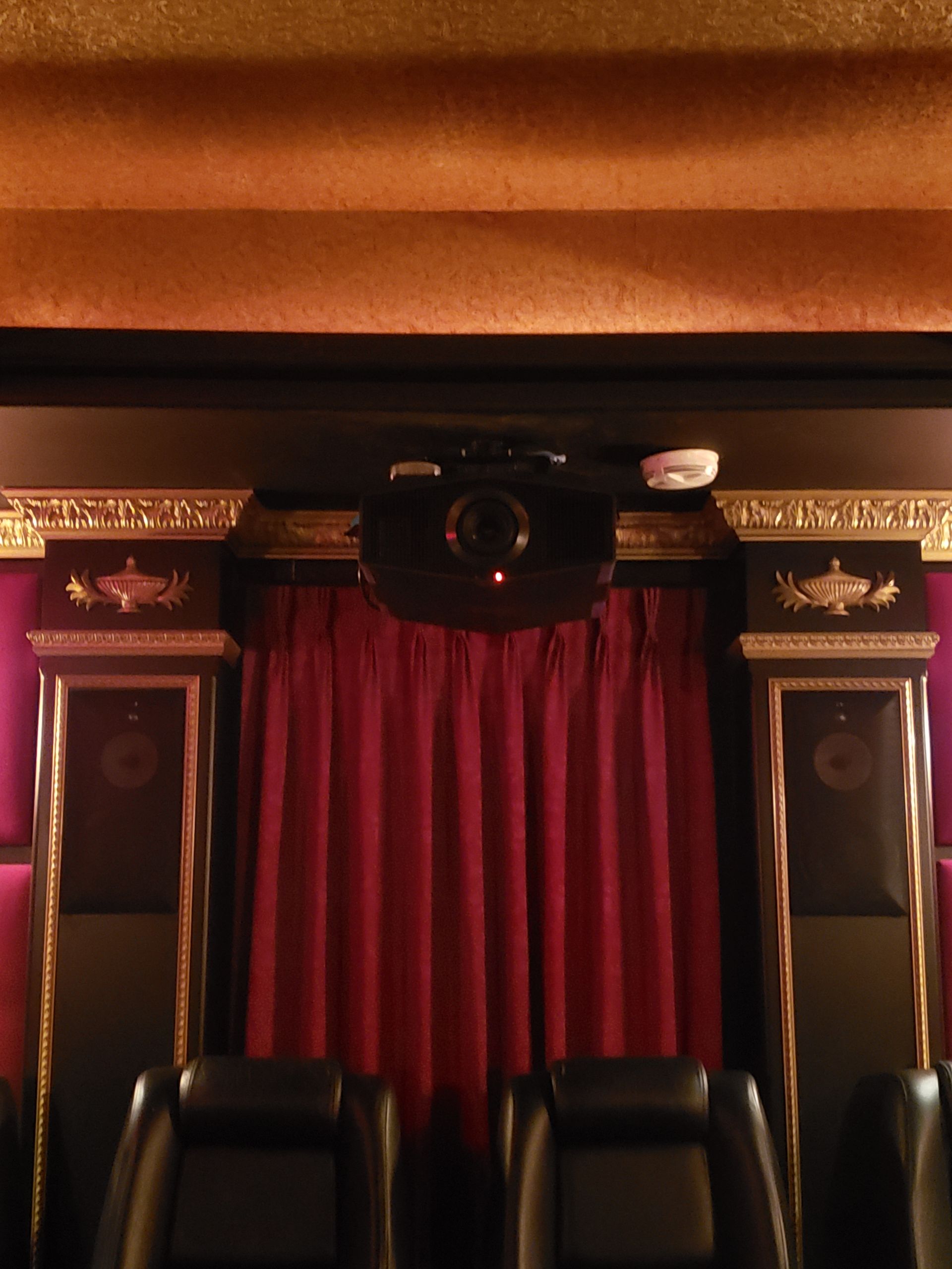 There is a large sectional couch in the middle of the room.