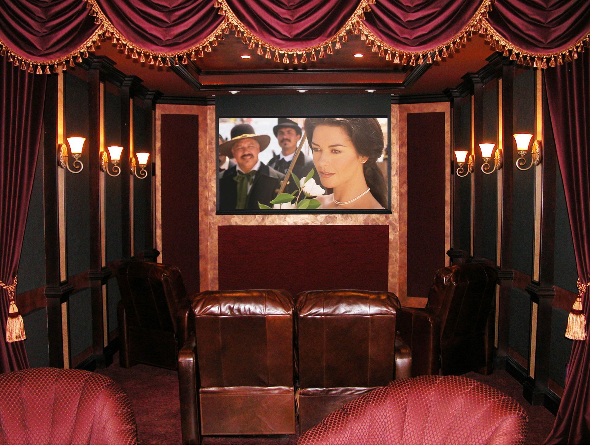 A movie theater with a screen showing a man and woman