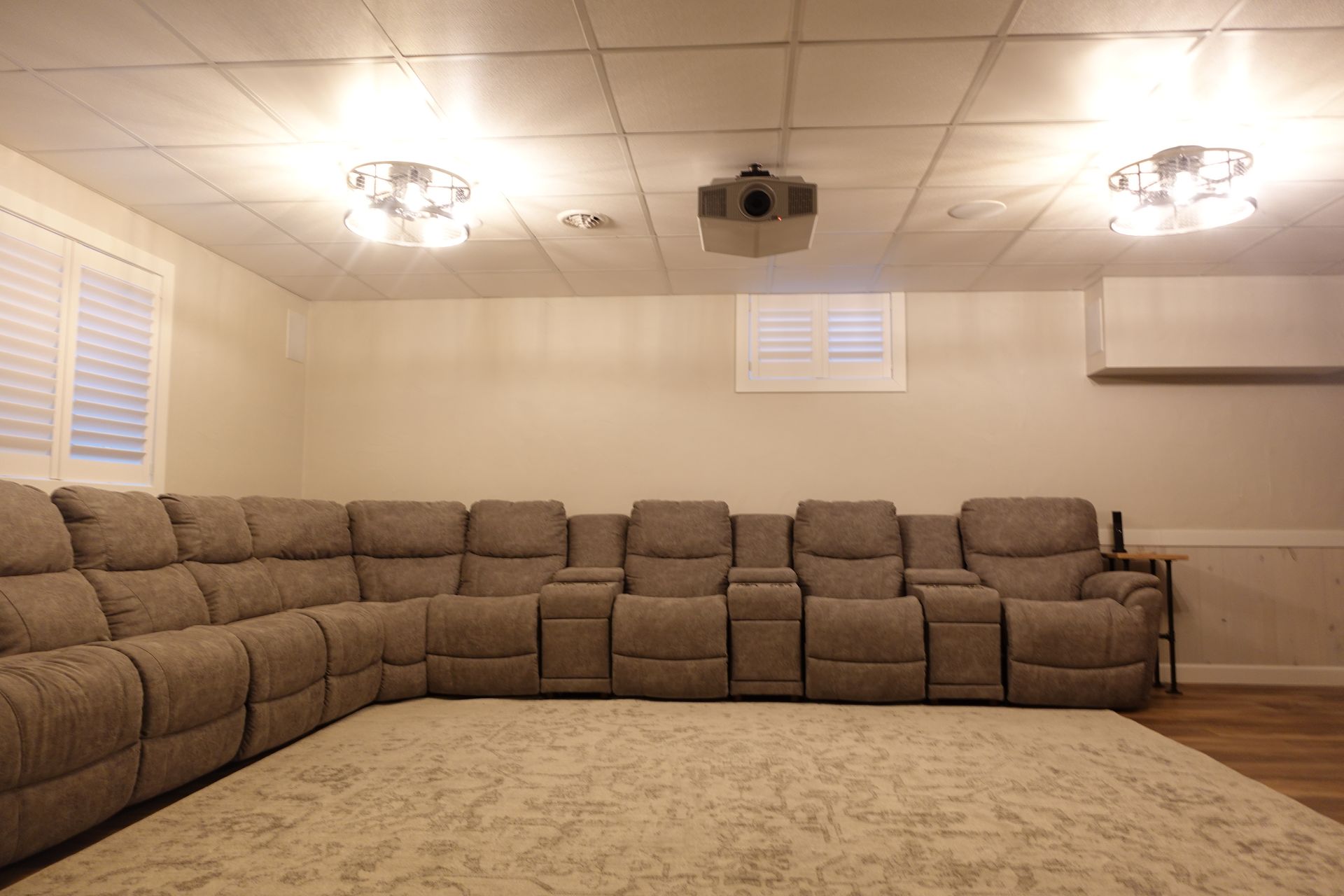 There is a large sectional couch in the middle of the room.