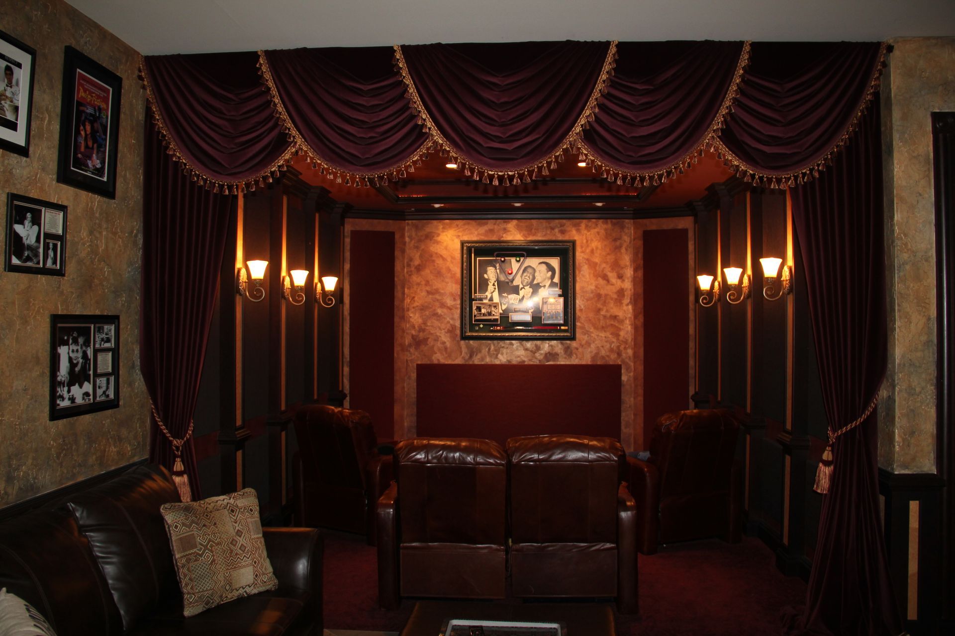 A living room with a couch and a picture on the wall