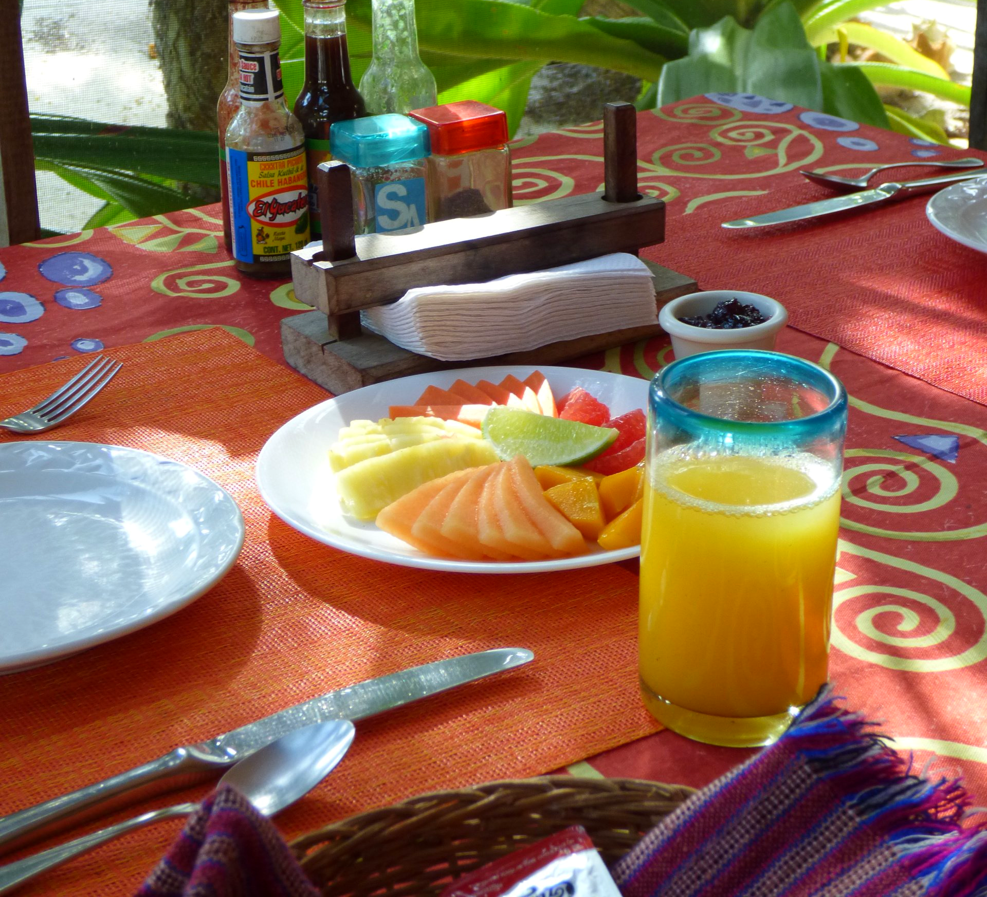 Fruit plate and freshly squeezed orange juice served at Restaurant