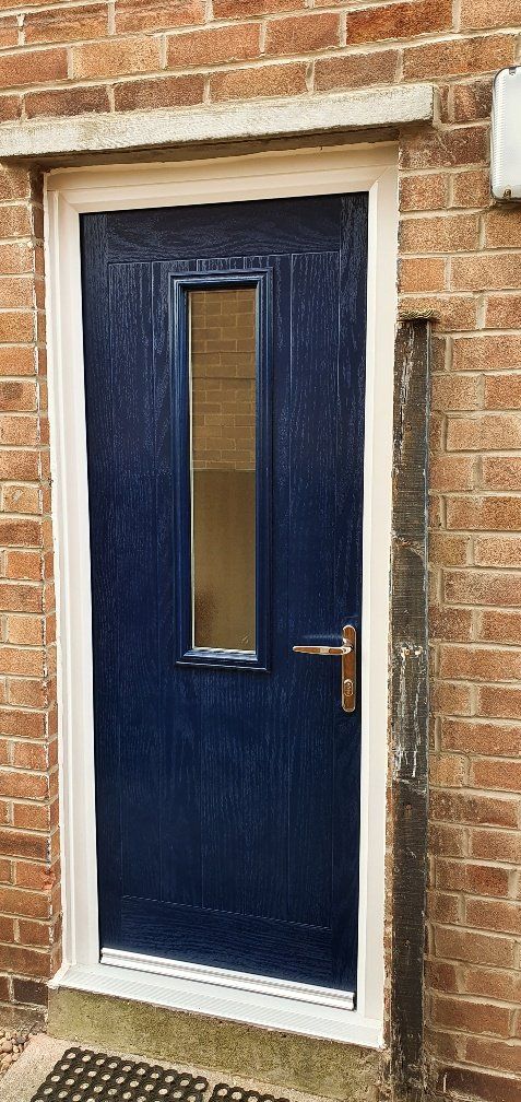 A blue door with a white frame 