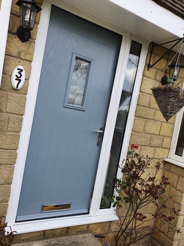 A blue front door with a white trim