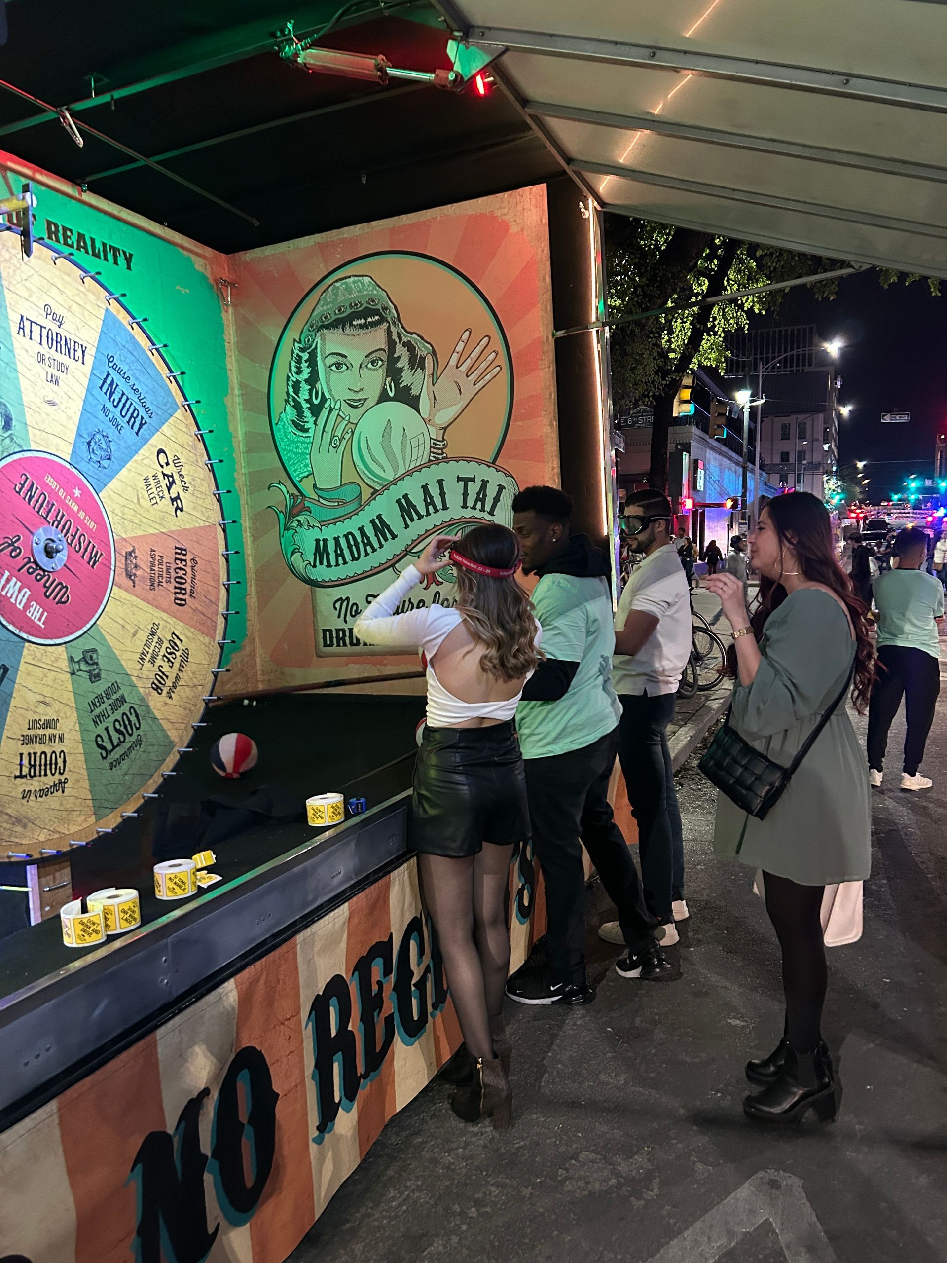 People playing a game with a sign that says no reg