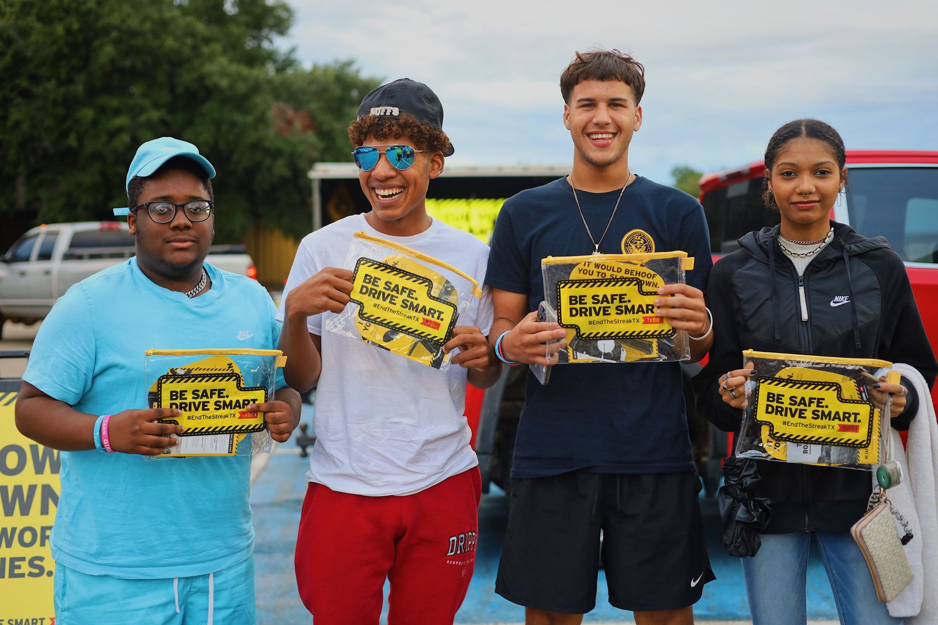 A group of young people are holding up signs that say no dogs
