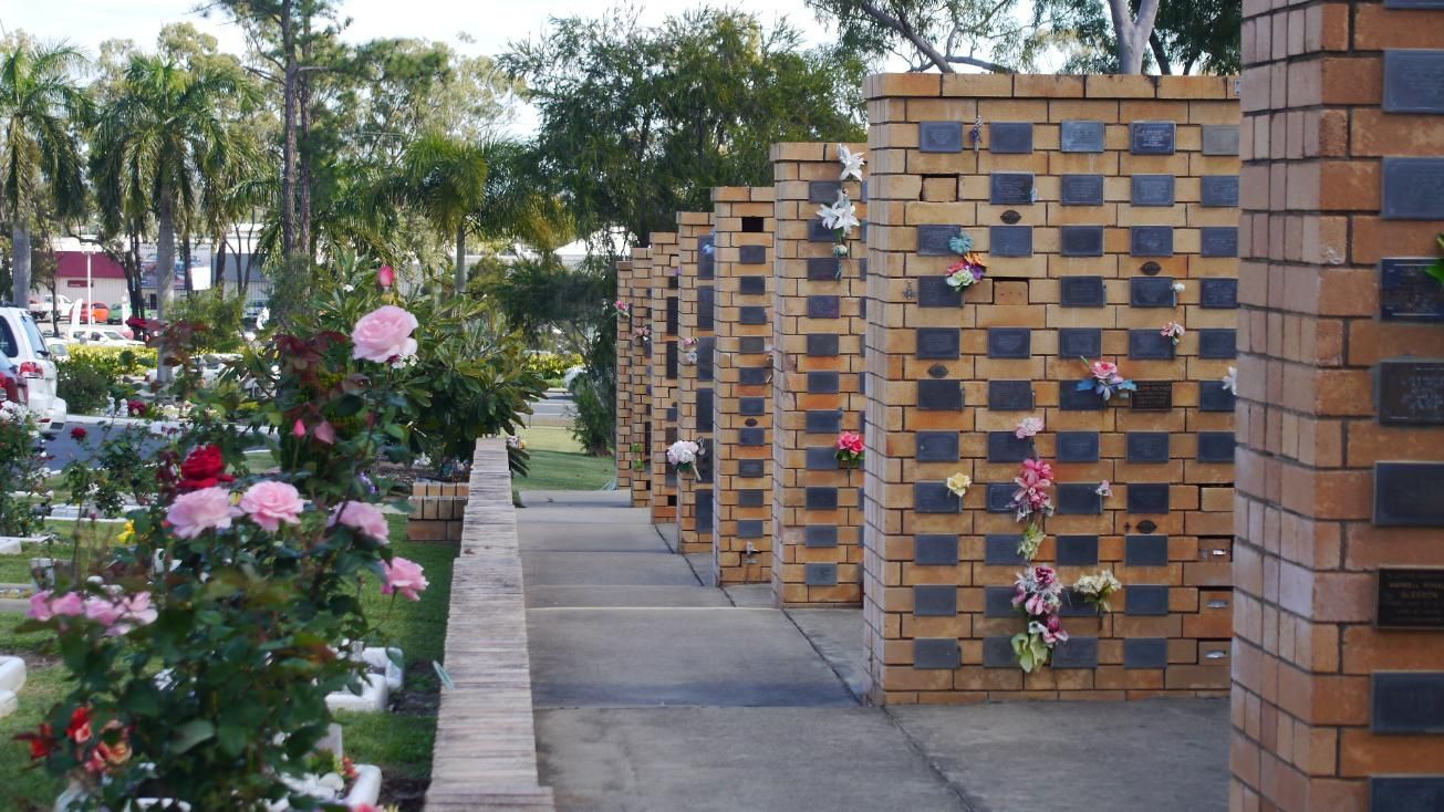 Row of Brick Columbarium Niches in A Cemetery with Flowers — Rockhampton Crematorium in Norman Gardens, QLD