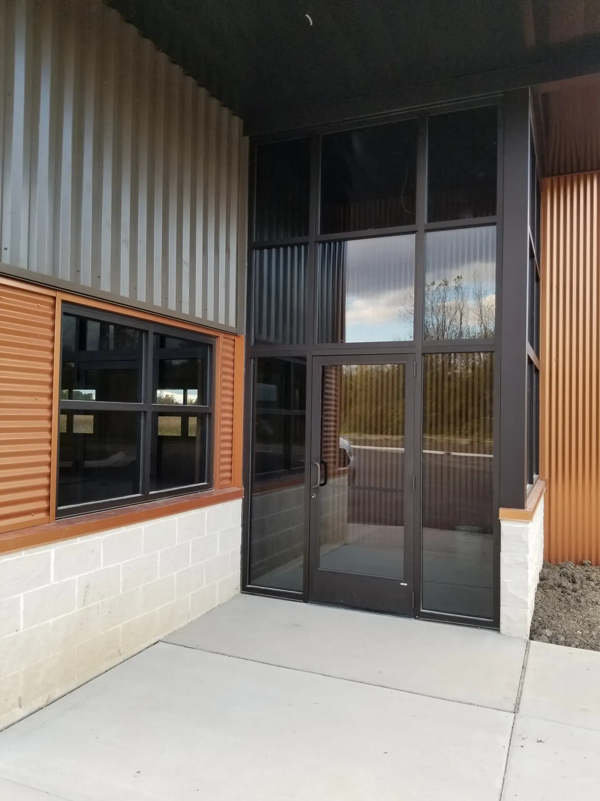 A building with a lot of windows and a door.